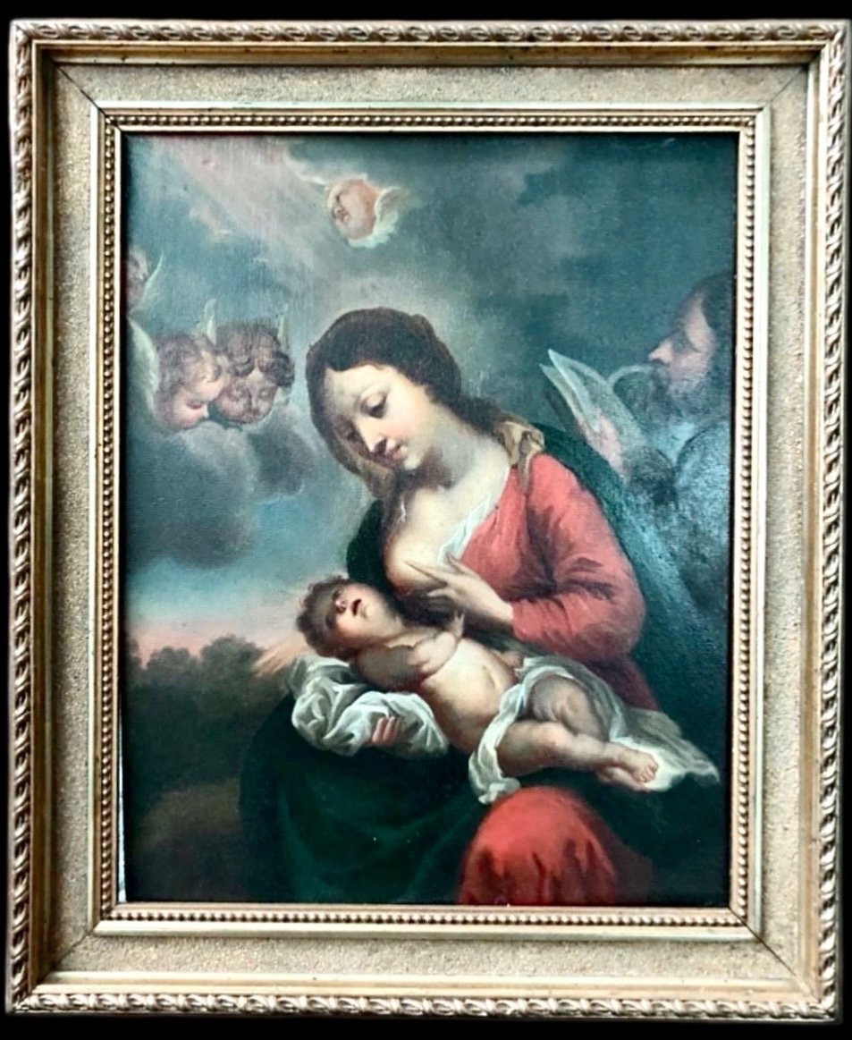 Dipinto olio su tavola con Madonna che allatta Gesu’Bambino.