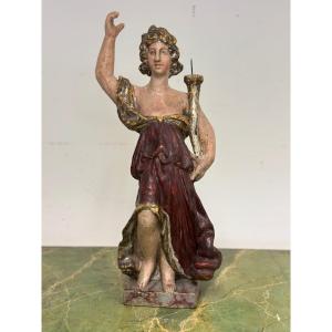 Scultura lignea di angelo con cornucopia reggicero policromo . Epoca fine 600