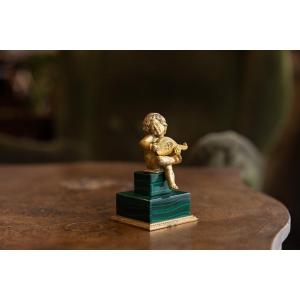 Putto in malachite e bronzo dorato