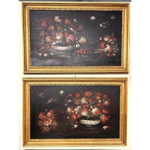 Coppia di nature morte del XVII secolo con vasi di fiori e volatili.