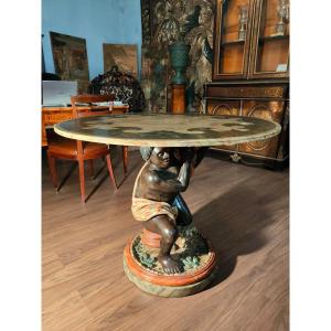 Tavolo in legno laccato sorretto da un moro veneziano dipinto