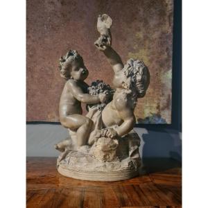 Gruppo in terracotta con due figure di putti con zolla XIX secolo manifattura Francese