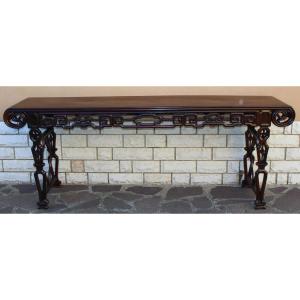 GRANDE CONSOLE CINESE IN LEGNO DURO INTAGLIATO E TRAFORATO, DINASTIA QING, XIX SECOLO.