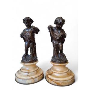 Coppia di putti in bronzo cesellato