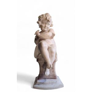 Scultura raffiurante Bambina con uccellino